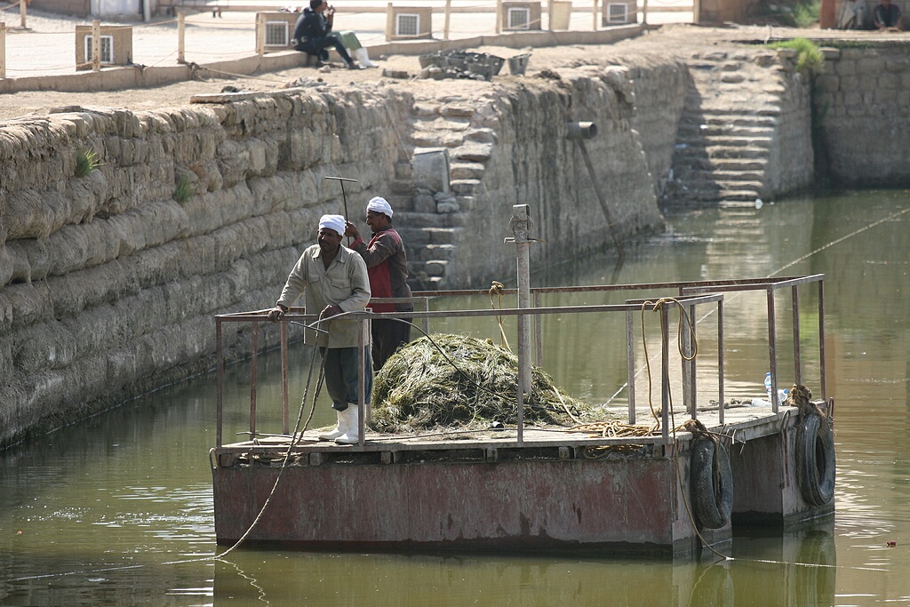 Workers in the pool where priests washed before offering sacrifices