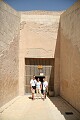 In front of an entrace to a tomb